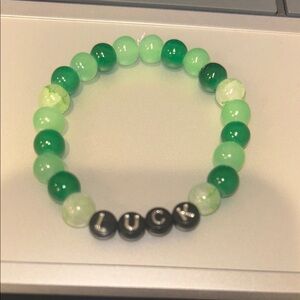 Green Beaded Bracelet with 'Luck' Charm